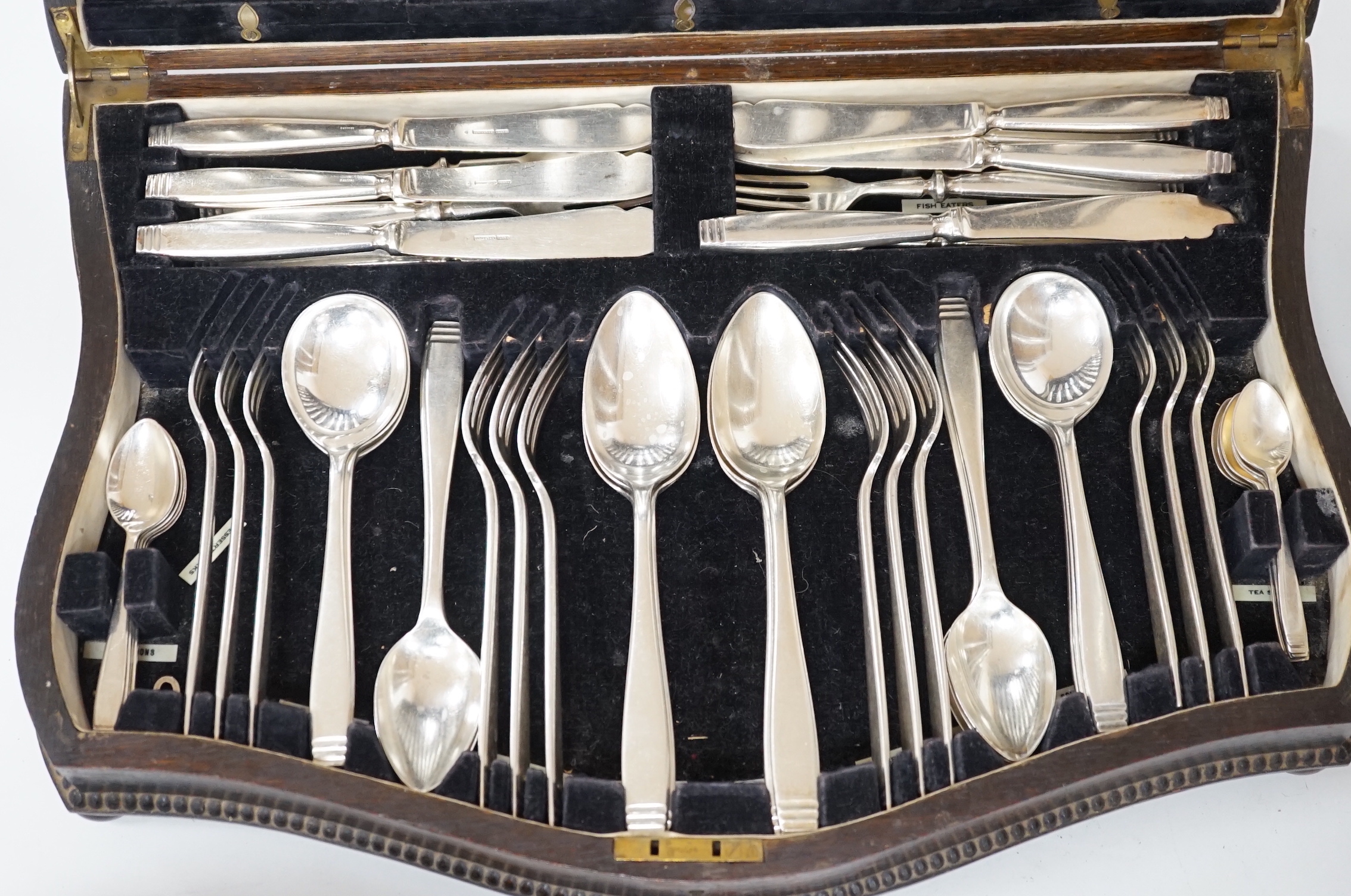 An oak canteen of plated cutlery